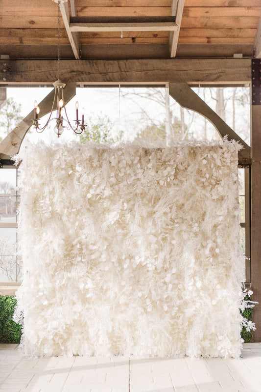 Isla Flower wall featuring faux florals with pampas grass accents for a lush inspired backdrop.