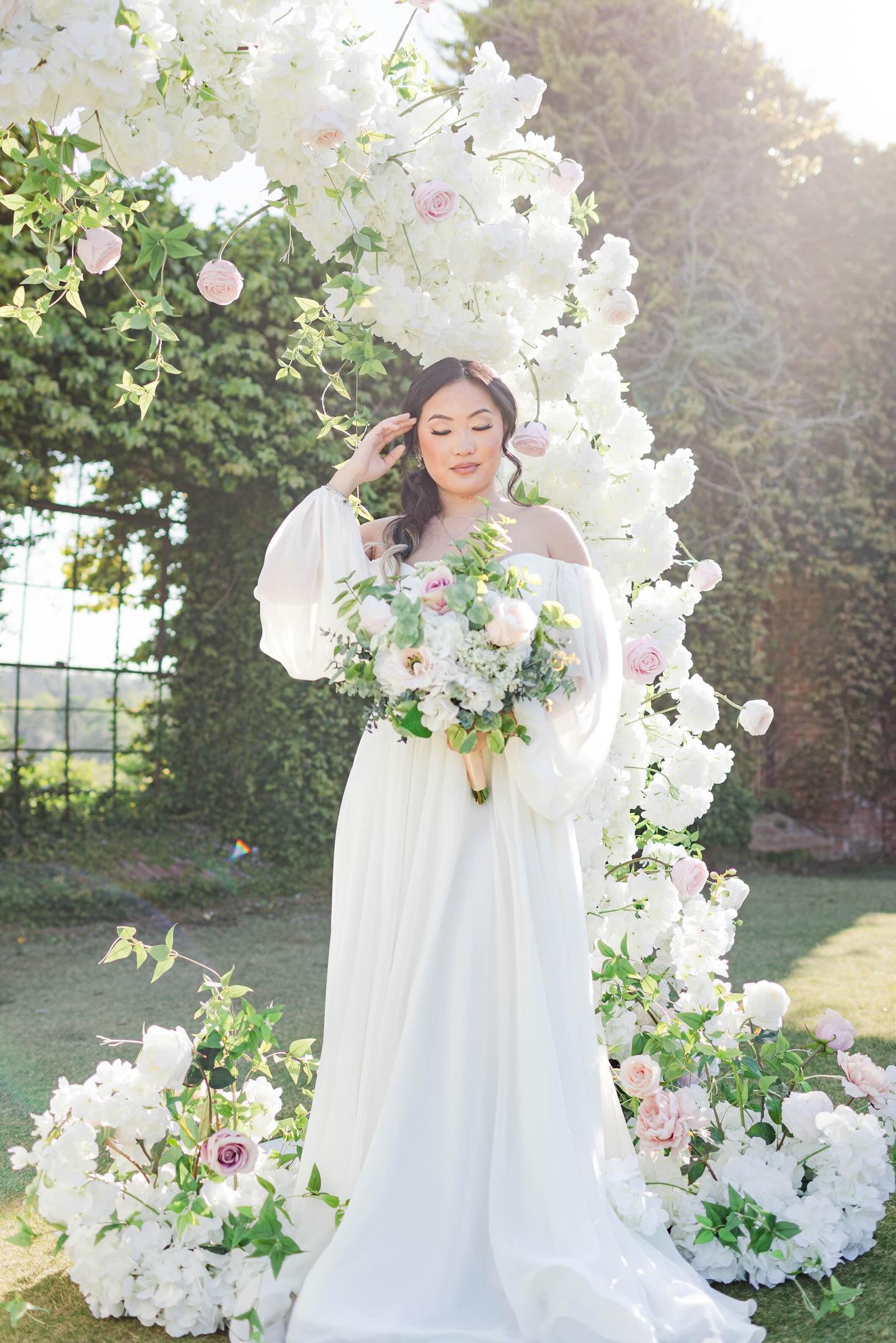 Side view of the Belle Bridal Bouquet in natural light, featuring realistic white florals and soft textures for a graceful, refined bridal look.