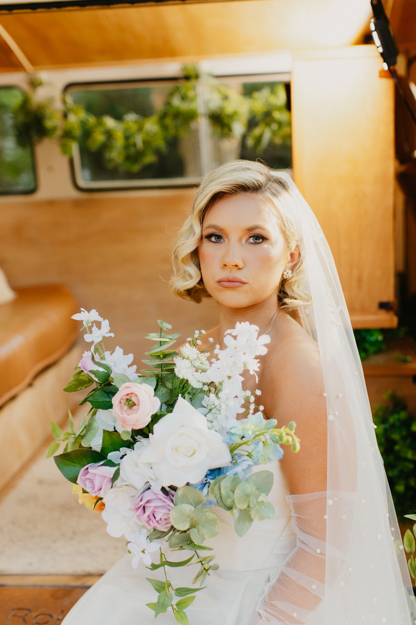Petite bunches f wildflower- inspired faux florals, ideal for lining rustic or outdoor wedding aisles.