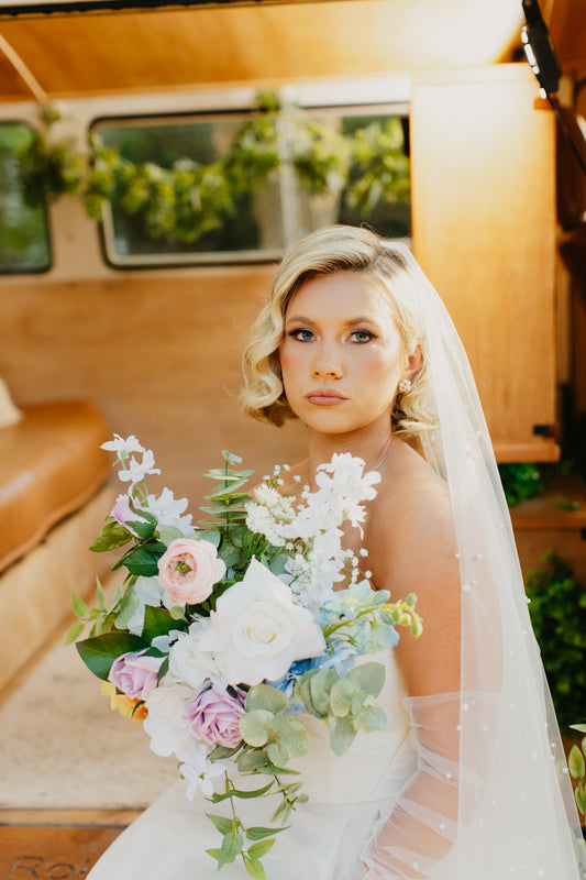Petite bunches f wildflower- inspired faux florals, ideal for lining rustic or outdoor wedding aisles.